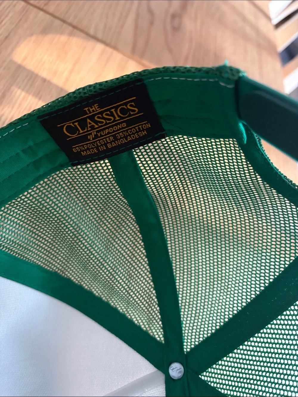 The Classic White and Green Trucker Hat with Nantucket masters Graphic
